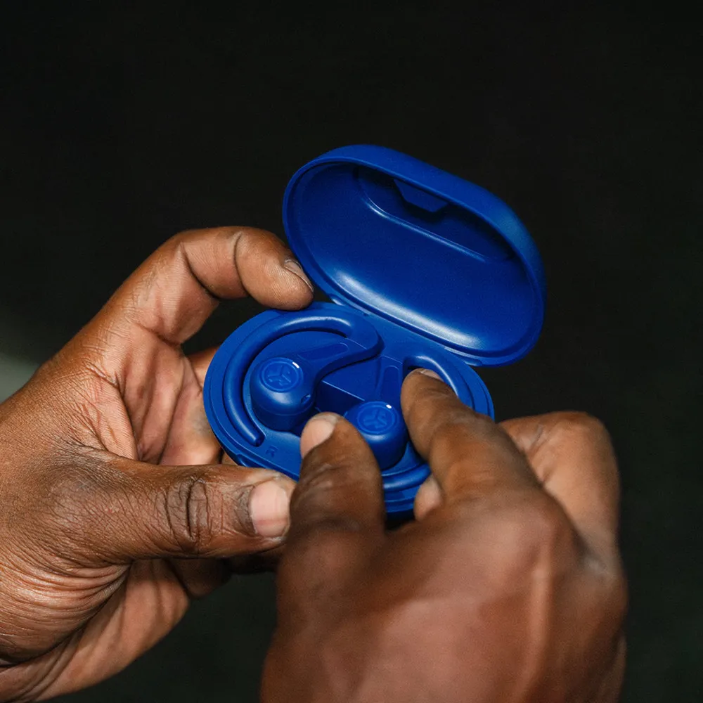 Blue JBuds Sport ANC 4 earbuds and case held in a hand